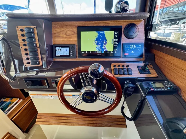  Yacht Photos Pics 2024 Ranger Tugs R-27 helm with modern navigation and control systems.