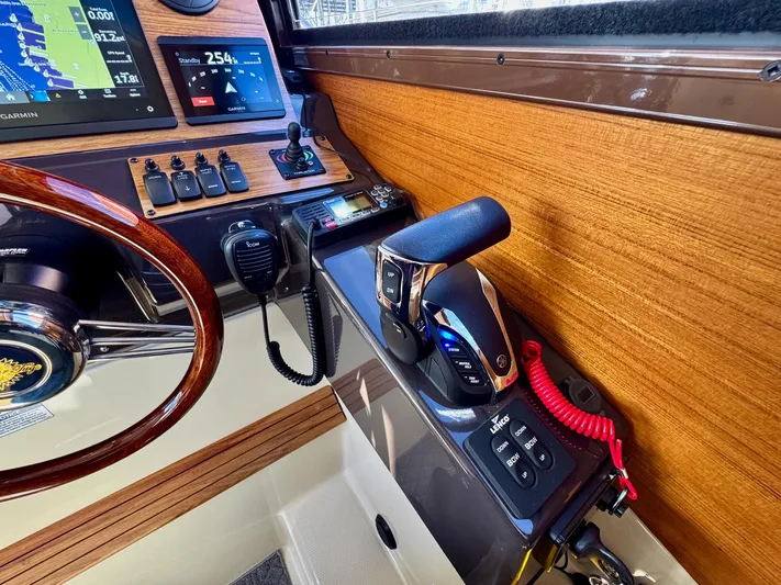  Yacht Photos Pics 2024 Ranger Tugs R-27 helm with modern controls and navigation displays.
