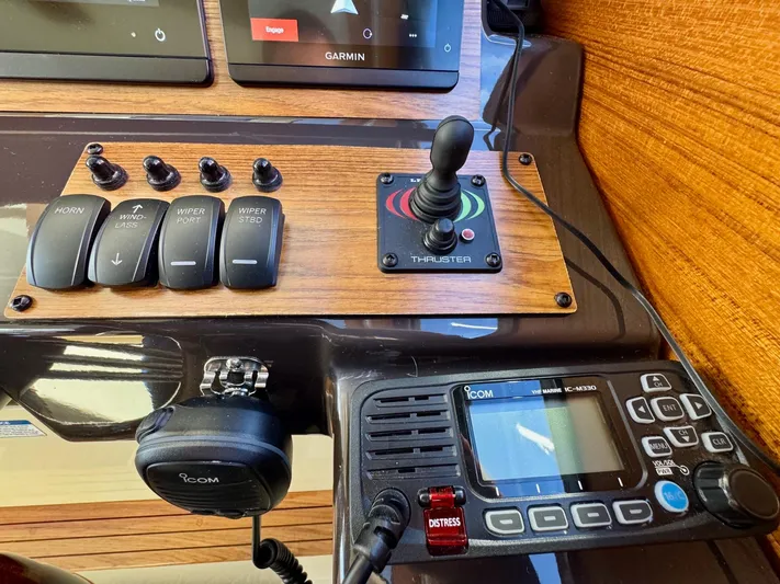  Yacht Photos Pics 2024 Ranger Tugs R-27 control panel with switches, joystick, and communication device.