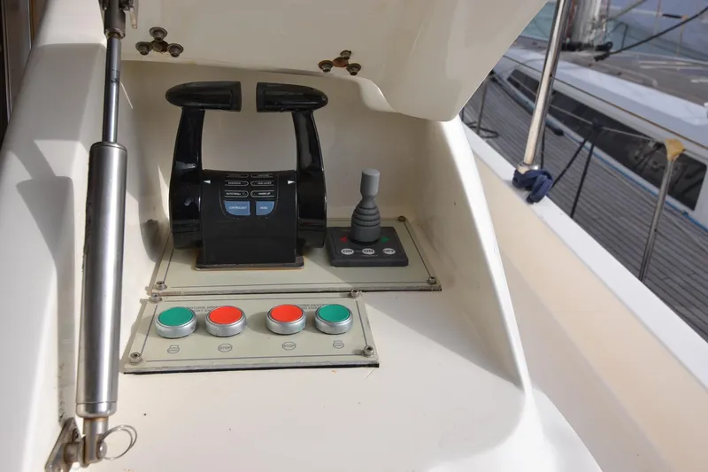  Yacht Photos Pics Control panel of a 2006 Ferretti Yachts 550, featuring throttle and buttons.