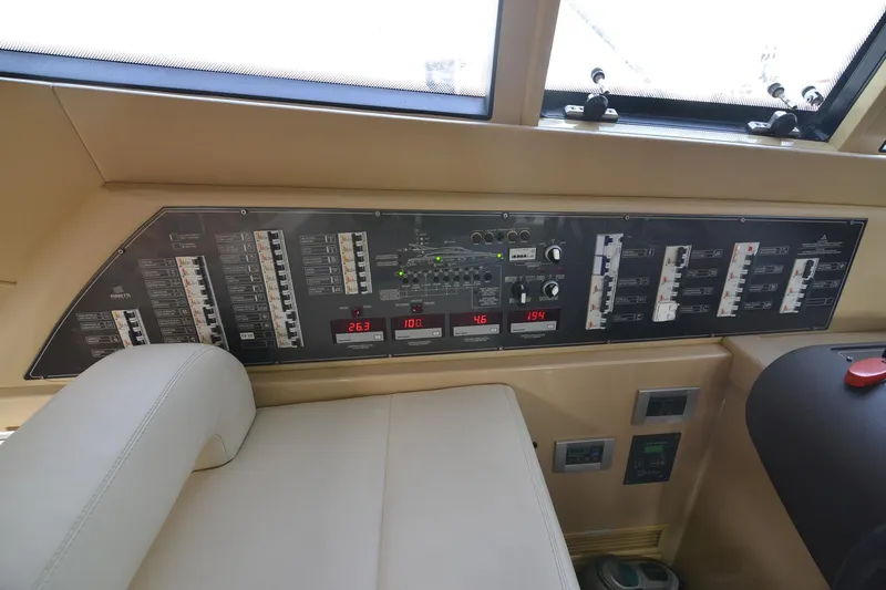  Yacht Photos Pics Control panel of a 2006 Ferretti Yachts 550, featuring various switches and displays.