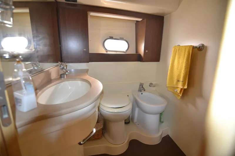  Yacht Photos Pics Luxurious bathroom in 2006 Ferretti Yachts 550, featuring modern fixtures and elegant design.