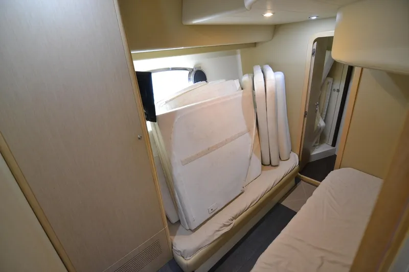  Yacht Photos Pics Interior cabin of 2006 Ferretti Yachts 550 with cushions and modern design.