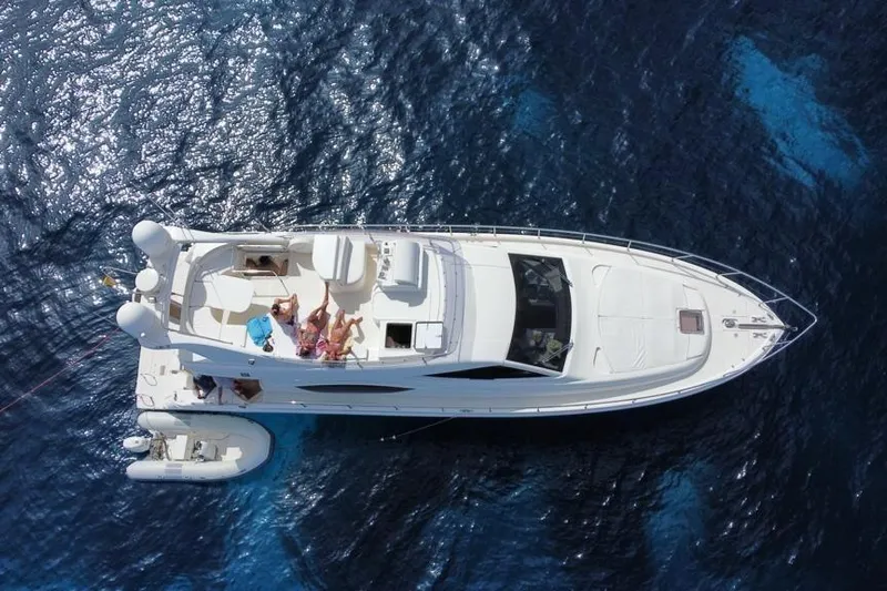  Yacht Photos Pics Aerial view of 2006 Ferretti Yachts 550 on blue ocean water.