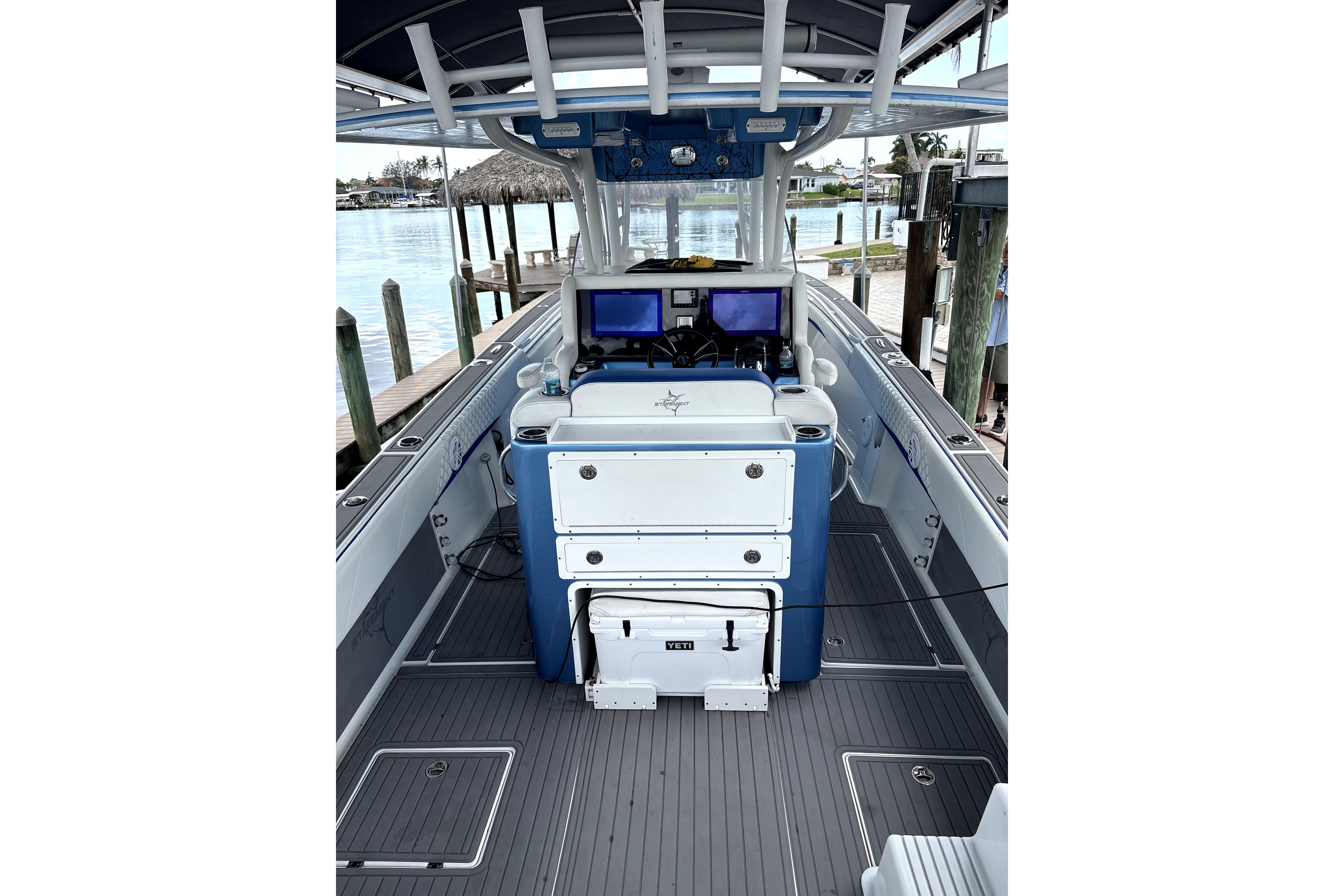 2019 Statement Fishing Edition boat interior with dual screens and storage compartments.
