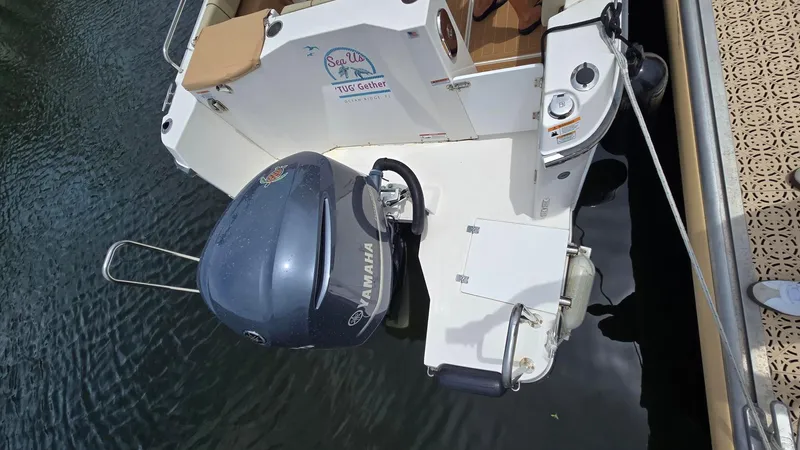  Yacht Photos Pics 2021 Ranger Tugs R-25 boat with Yamaha outboard motor docked at marina.