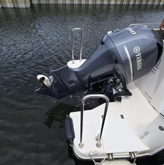  Yacht Photos Pics Yamaha outboard motor on 2021 Ranger Tugs R-25 boat, docked in calm water.