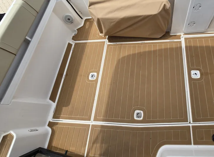  Yacht Photos Pics 2021 Ranger Tugs R-25 boat deck with brown non-slip flooring.