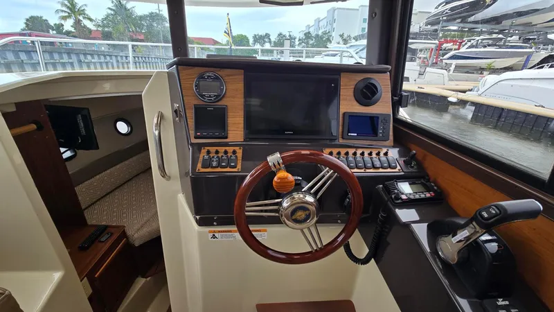  Yacht Photos Pics 2021 Ranger Tugs R-25 helm with modern controls and navigation equipment.