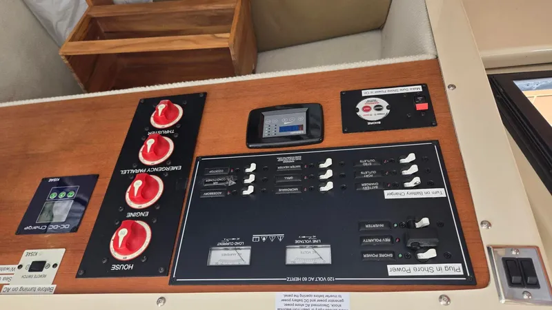  Yacht Photos Pics Control panel of a 2021 Ranger Tugs R-25 boat, featuring switches and gauges.