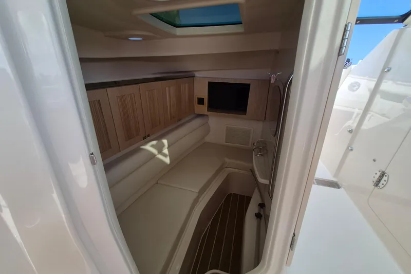 346-624 Yacht Photos Pics Interior cabin of 2026 Grady-White Freedom 345 boat with seating and storage.
