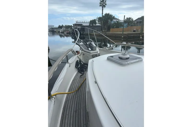  Yacht Photos Pics 1996 Grand Banks 36 Motoryacht docked, showcasing deck and marina view.