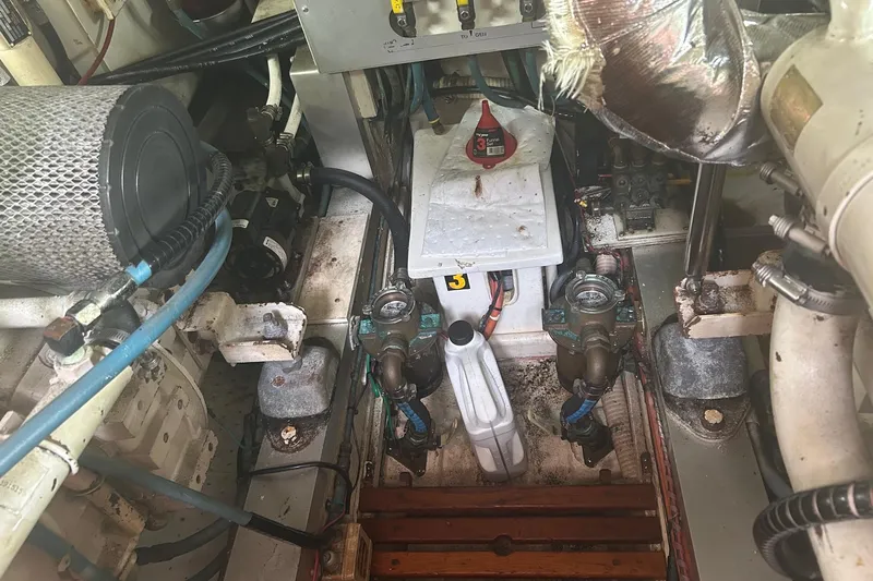  Yacht Photos Pics Engine room of a 1996 Grand Banks 36 Motoryacht, showcasing mechanical components and wiring.
