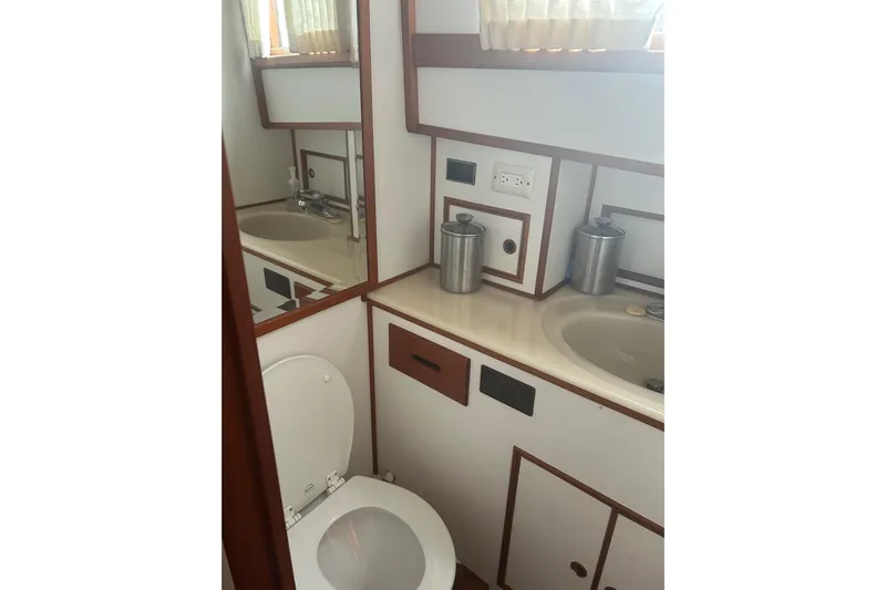  Yacht Photos Pics Bathroom interior of 1996 Grand Banks 36 Motoryacht with sink and toilet.