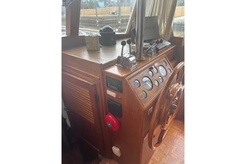  Yacht Photos Pics Helm of 1996 Grand Banks 36 Motoryacht with wooden wheel and navigation instruments.