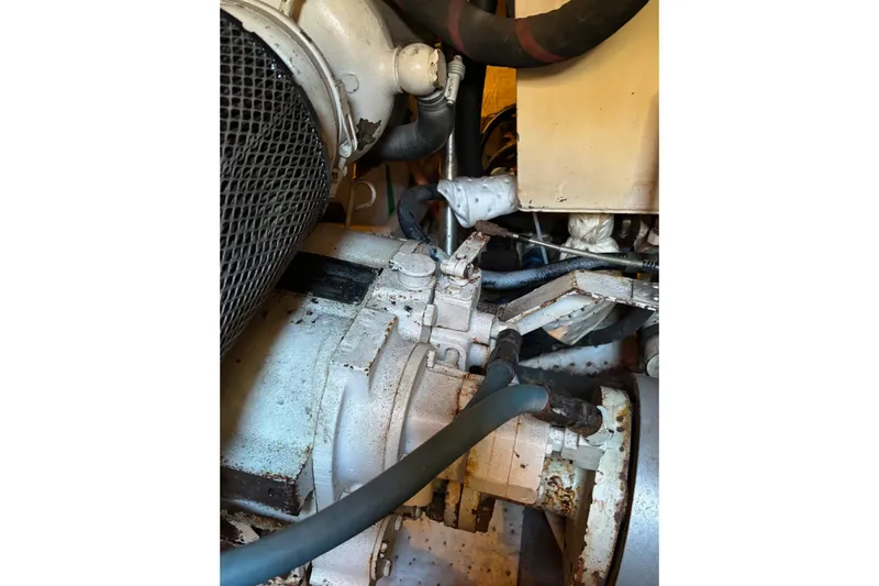  Yacht Photos Pics Engine compartment of a 1996 Grand Banks 36 Motoryacht, showing mechanical components and hoses.