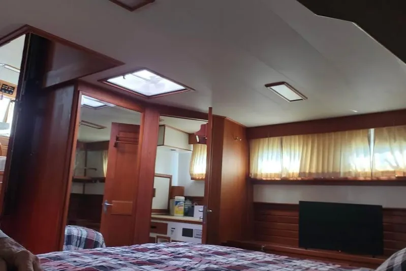  Yacht Photos Pics Interior of 1996 Grand Banks 36 Sedan with wood paneling and cozy furnishings.