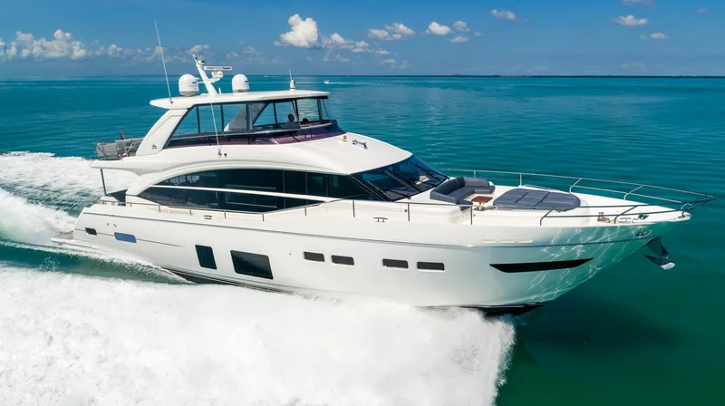 Comfortably Numb Yacht Photos Pics 2018 Princess Y75 Motor Yacht cruising on clear blue waters.