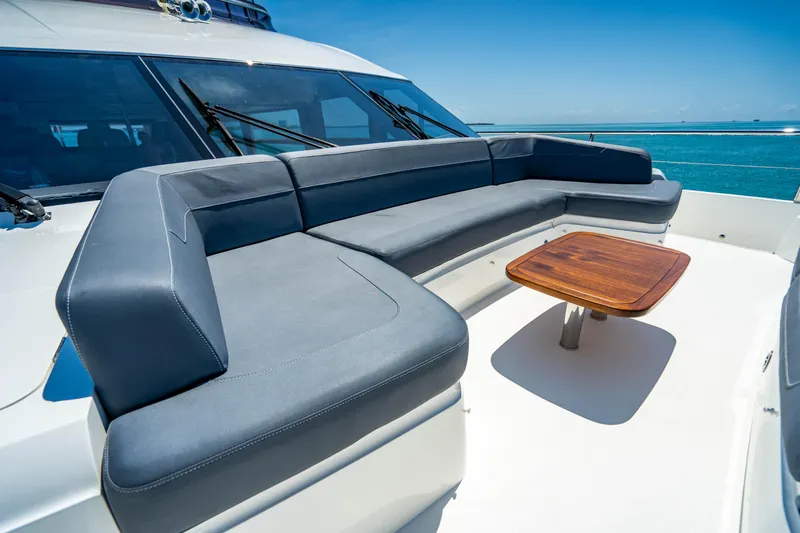 Comfortably Numb Yacht Photos Pics 2018 Princess Y75 Motor Yacht deck with seating and table.