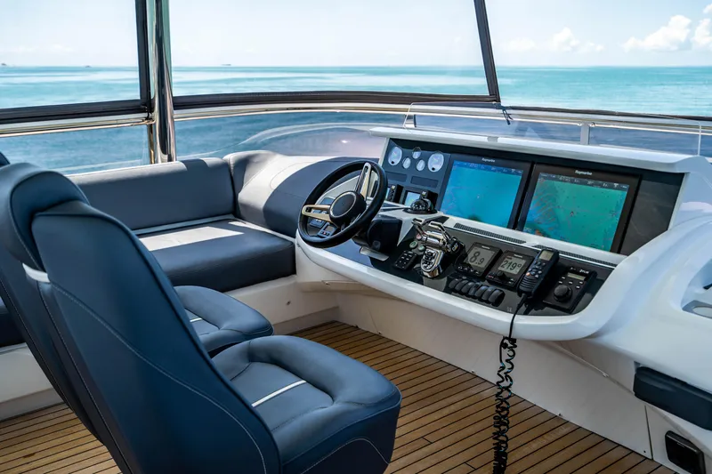 Comfortably Numb Yacht Photos Pics 2018 Princess Y75 Motor Yacht helm station with ocean view and advanced navigation systems.