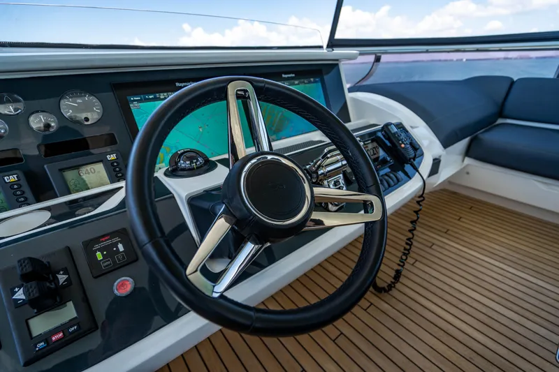 Comfortably Numb Yacht Photos Pics Steering wheel and dashboard of a 2018 Princess Y75 Motor Yacht.