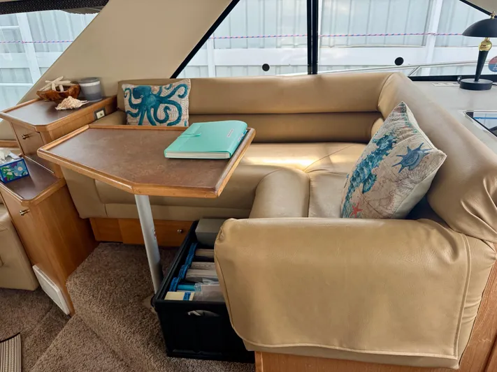 The Journey Yacht Photos Pics 1999 Bayliner 3988 Command Bridge Motoryacht interior with beige seating and decorative pillows.