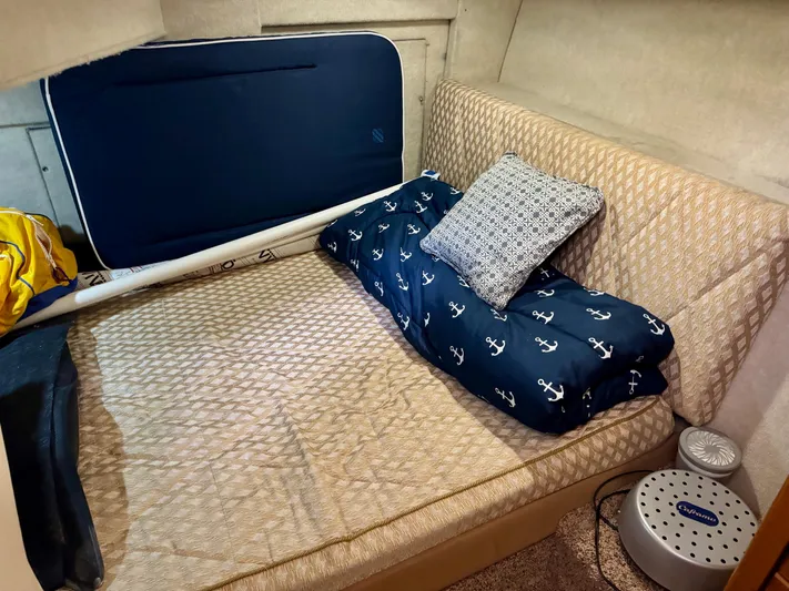 The Journey Yacht Photos Pics Cozy cabin interior of 1999 Bayliner 3988 Command Bridge Motoryacht with nautical-themed bedding.