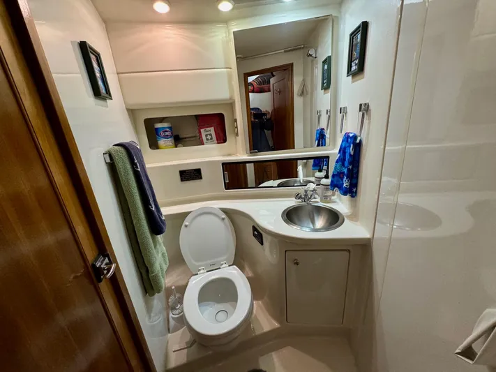 The Journey Yacht Photos Pics Bathroom interior of 1999 Bayliner 3988 Command Bridge Motoryacht, featuring sink and toilet.