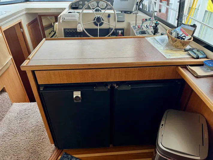 The Journey Yacht Photos Pics 1999 Bayliner 3988 Command Bridge Motoryacht interior with helm, controls, and storage.