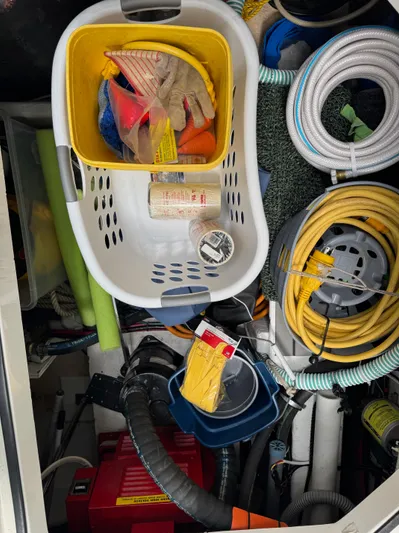 The Journey Yacht Photos Pics Storage compartment of a 1999 Bayliner 3988 yacht with tools and supplies.