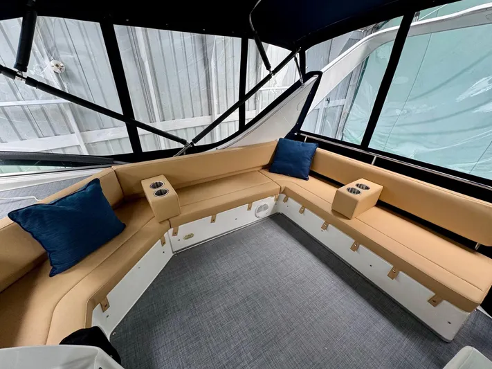 The Journey Yacht Photos Pics 1999 Bayliner 3988 Command Bridge Motoryacht interior with beige seating and blue cushions.