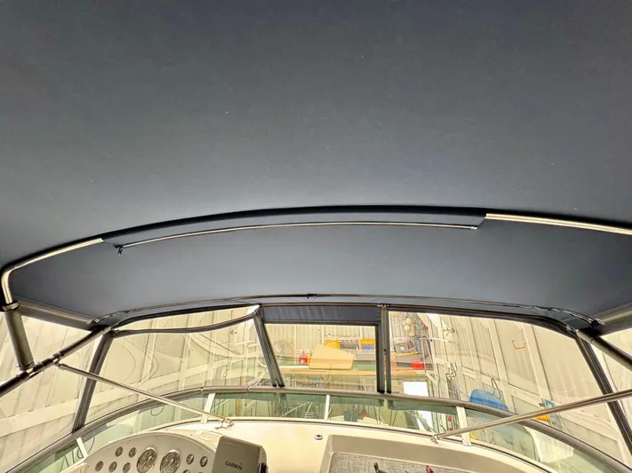 The Journey Yacht Photos Pics 1999 Bayliner 3988 Command Bridge Motoryacht interior view with helm and canopy.