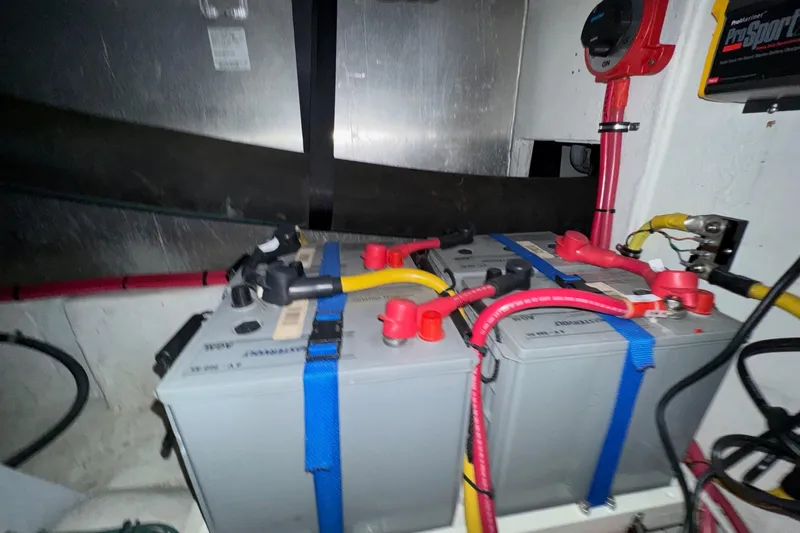 The Journey Yacht Photos Pics Battery compartment of 1999 Bayliner 3988 Command Bridge Motoryacht with cables and connections.