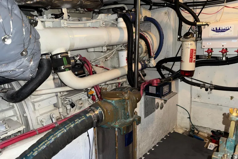 The Journey Yacht Photos Pics Engine room of a 1999 Bayliner 3988 Command Bridge Motoryacht, showcasing mechanical components.