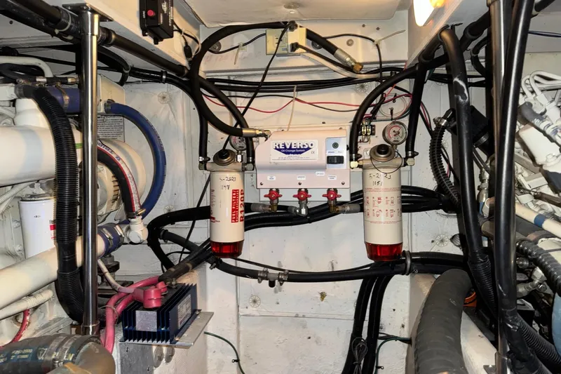 The Journey Yacht Photos Pics Engine room of 1999 Bayliner 3988 Command Bridge Motoryacht with fuel filters and wiring.