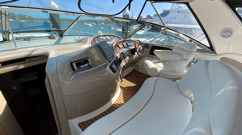  Yacht Photos Pics 1999 Sea Ray 460 Sundancer helm with luxurious seating and modern controls, overlooking marina.