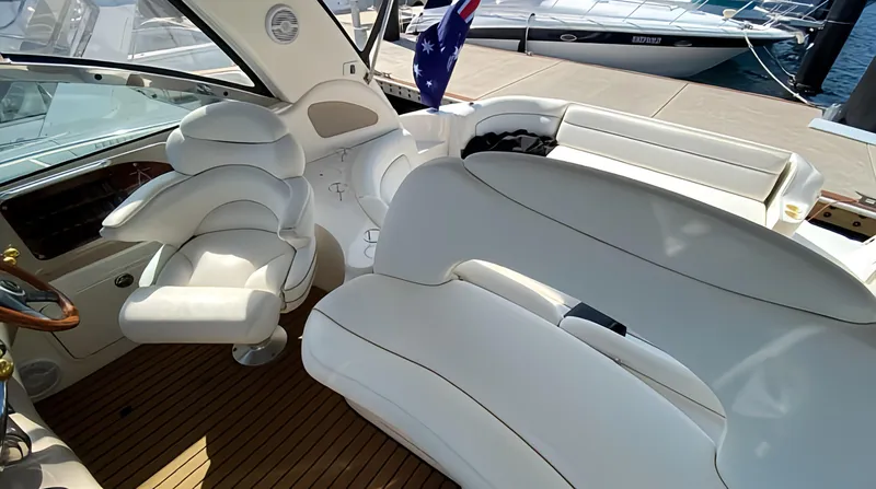  Yacht Photos Pics 1999 Sea Ray 460 Sundancer yacht interior with white seating and wooden flooring.