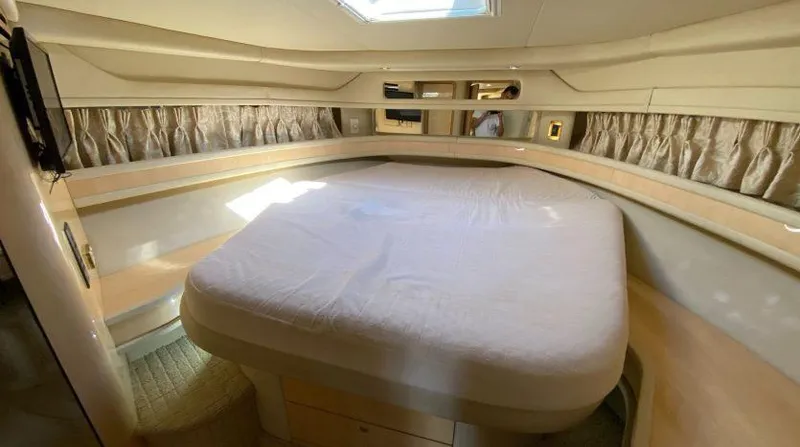  Yacht Photos Pics Luxurious cabin interior of 1999 Sea Ray 460 Sundancer yacht with cozy bed.