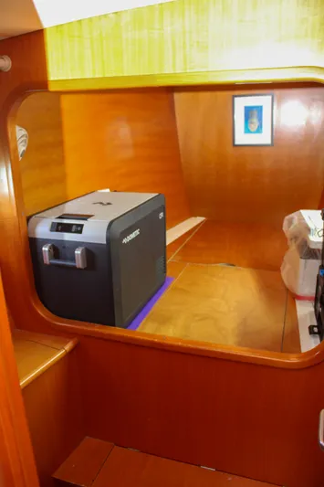 One Life Yacht Photos Pics Interior of 2002 Lagoon 410 yacht with wooden paneling and compact appliances.