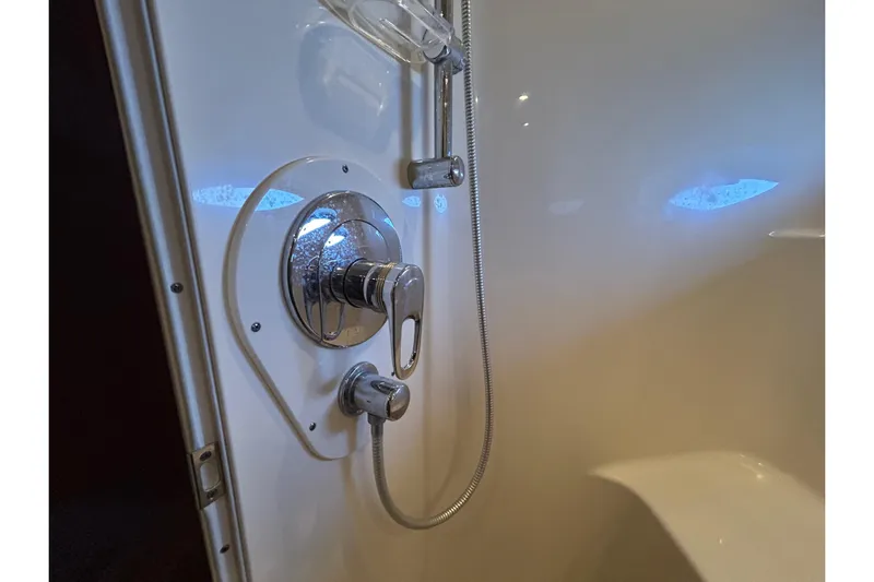 Blue Diamond Yacht Photos Pics Shower controls in 2005 Sea Ray 500 Sundancer yacht bathroom, featuring chrome fixtures.