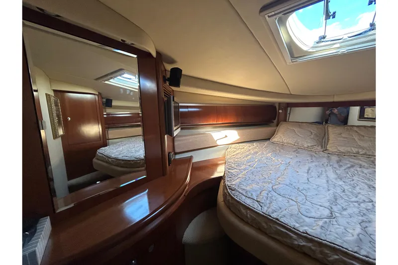 Blue Diamond Yacht Photos Pics Luxurious cabin interior of 2005 Sea Ray 500 Sundancer yacht with elegant bedding.
