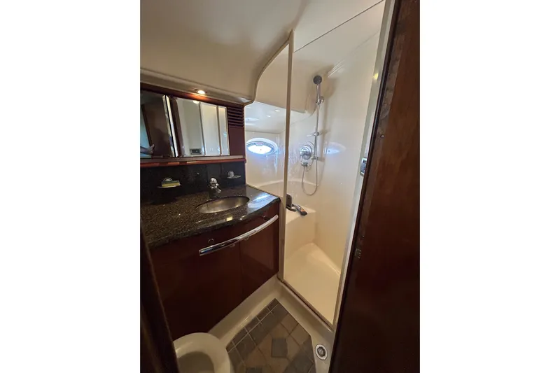 Blue Diamond Yacht Photos Pics Luxurious bathroom in 2005 Sea Ray 500 Sundancer yacht with shower and granite countertop.