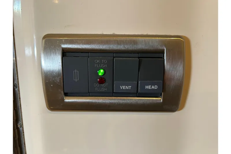 Blue Diamond Yacht Photos Pics Control panel on 2005 Sea Ray 500 Sundancer with flush and vent buttons.