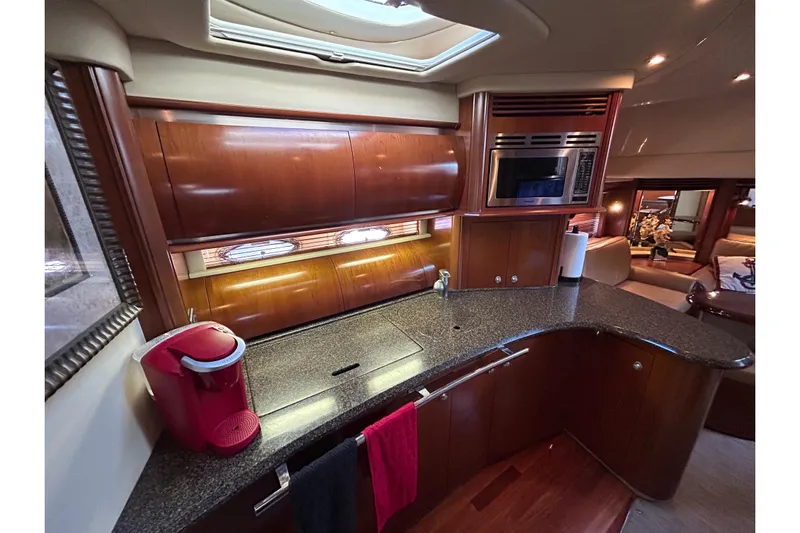 Blue Diamond Yacht Photos Pics Luxurious 2005 Sea Ray 500 Sundancer yacht interior kitchen with modern amenities.