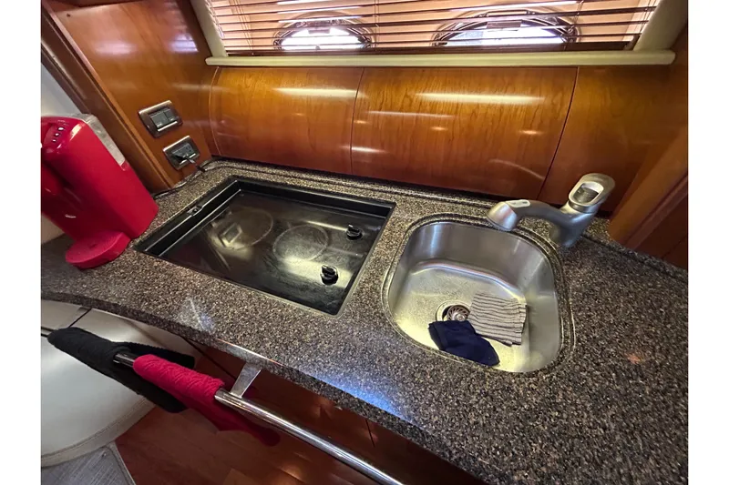 Blue Diamond Yacht Photos Pics Luxurious 2005 Sea Ray 500 Sundancer yacht kitchen with granite countertop and modern appliances.