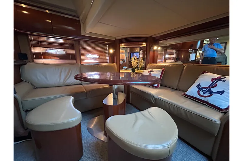 Blue Diamond Yacht Photos Pics Luxurious interior of 2005 Sea Ray 500 Sundancer yacht with leather seating and nautical decor.
