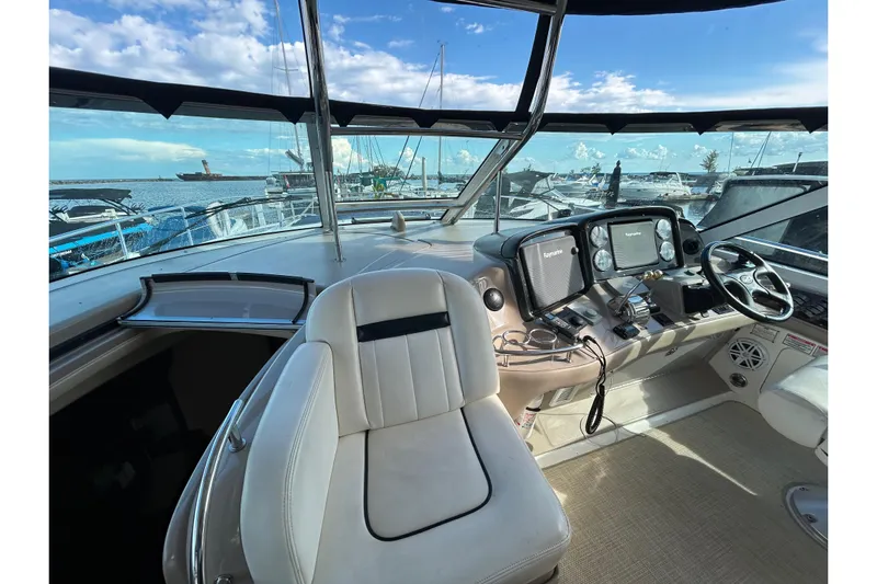 Blue Diamond Yacht Photos Pics Interior view of 2005 Sea Ray 500 Sundancer yacht cockpit with navigation equipment.