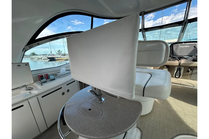 Blue Diamond Yacht Photos Pics Interior of 2005 Sea Ray 500 Sundancer yacht with seating and helm station.