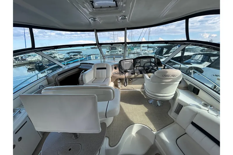 Blue Diamond Yacht Photos Pics Interior view of 2005 Sea Ray 500 Sundancer yacht cockpit with luxurious seating and controls.