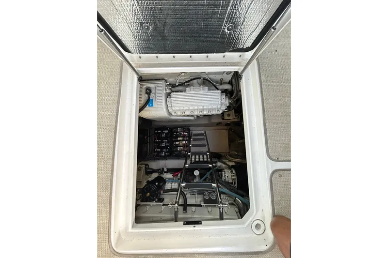 Blue Diamond Yacht Photos Pics Engine compartment of a 2005 Sea Ray 500 Sundancer boat, showing mechanical components.